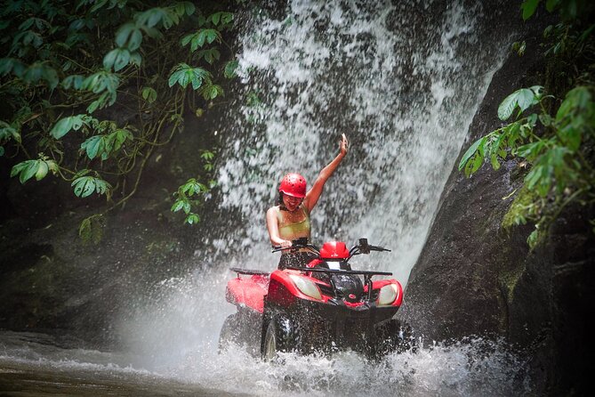 ATV Quad Bike Kuber Through Waterfall, Tunnel And Rice Field - Rice fields, farms, and village roads slow the view down