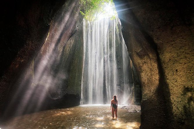Bali Tour : Tegenungan - Tukad Cepung - Kanto Lampo - Tibumana Waterfall - Kanto Lampo over broad natural rock steps