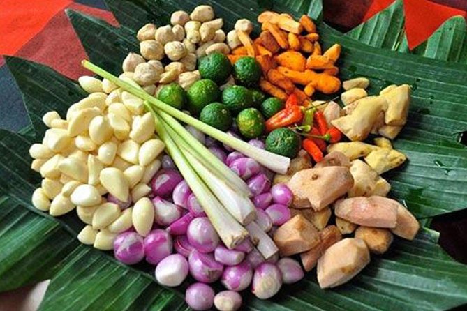 Balinese Cooking class with traditional morning market visit - Making a canang before you touch the stove