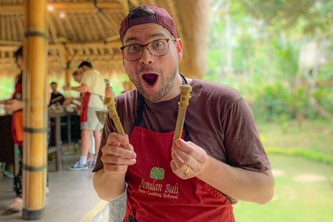 Balinese Farm Cooking Class by Pemulan Bali - Picking herbs and produce at the organic farm