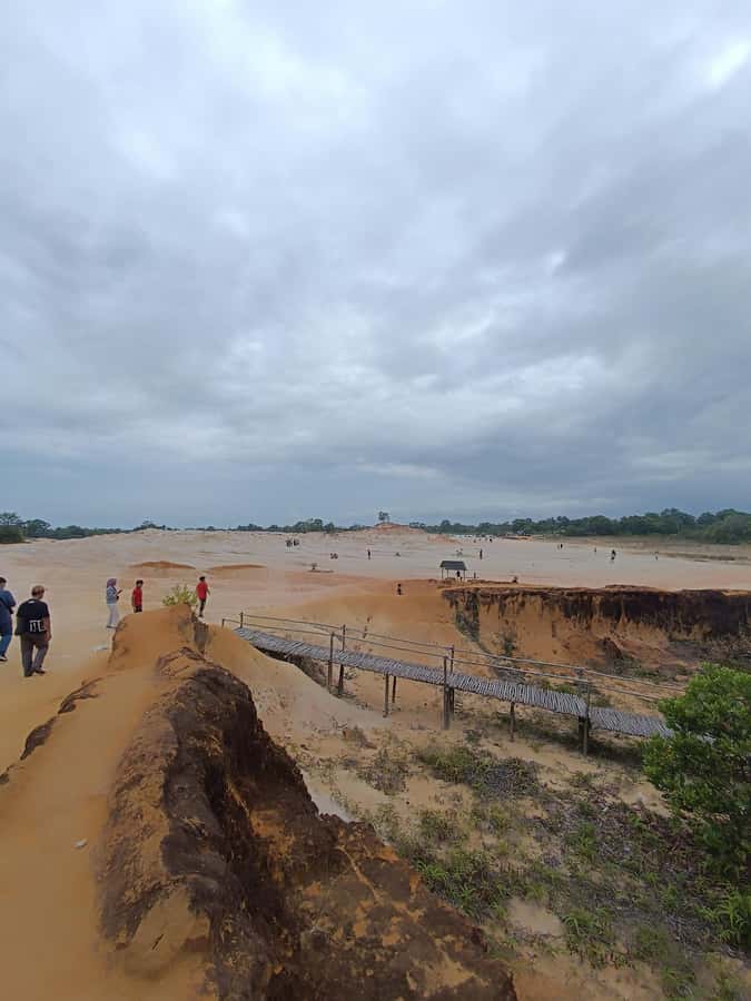 Bintan Desert And Blue Lake Private Tour - White sand beside a rain-filled blue lake