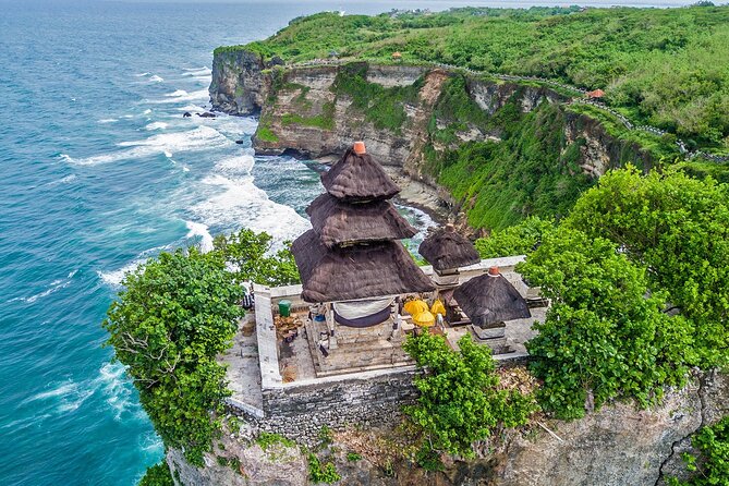Kecak Fire Dance and Sunset at Uluwatu Temple All Inclusive - Entering Uluwatu Temple with a sarong