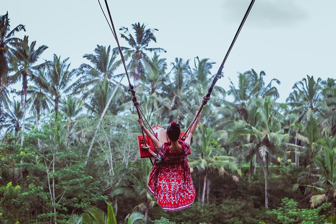 Ubud and Tanah Lot Temple Small Group Sunset Tour - Cooling off at Kanto Lampo Waterfall